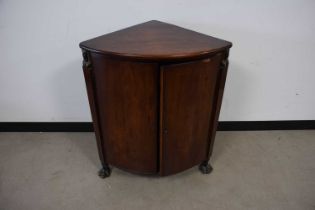 A Regency style mahogany corner cabinet,