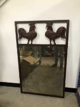 A modern metal framed mirror,