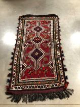 A woollen Iranian rug,