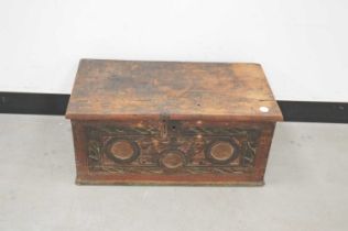 A 19th century or earlier small carved wooden and painted chest,