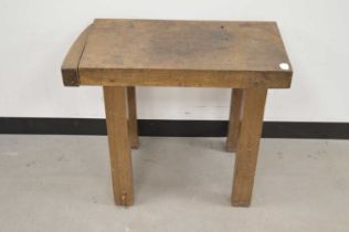 A small antique rustic table