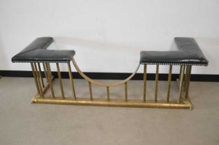 A vintage brass and upholstered club fender,