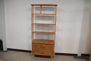 A c1970s Ercol bookcase and storage unit,