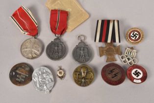 An assortment of German medallions and badges,
