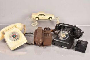 A group of vintage telephones,