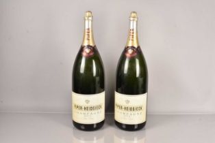 A pair of large display bottles of Piper-Heidsieck Champagne,