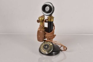 A vintage stick telephone,