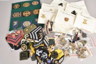 A large collection of Modern British and Overseas cap badges,