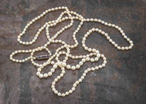 A certificated string of natural saltwater graduated knotted strung pearls,