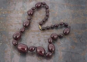 A graduated oval string of 'cherry amber',