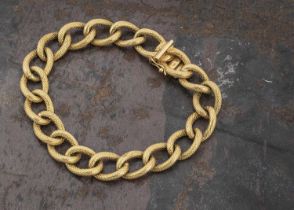An 18ct gold continental curb link textured chain bracelet,