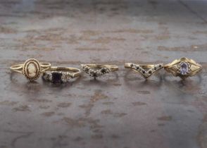 Four 9ct gold gem set dress rings,