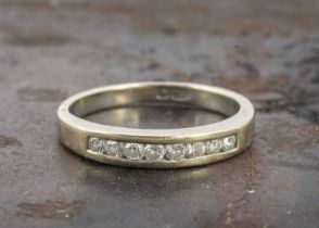 An 18ct continental diamond half hoop eternity ring,