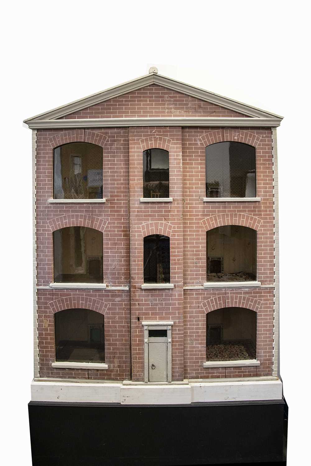 A large late 19th century painted wooden dolls’ house,