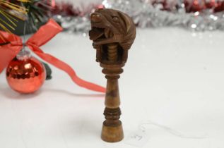 A late 19th or early 20th century Black Forest wooden nut cracker,