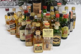 A collection of whisky miniatures,