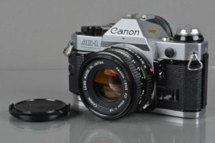 A Canon AE-1 Program SLR Camera,