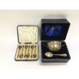 A cased silver presentation bowl and spoon togethe