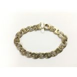 A heavy 9ct gold diamond set bracelet, approx 27.5