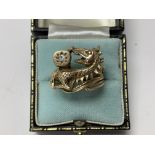 A 9ct gold ring in the form of a dragon inset with