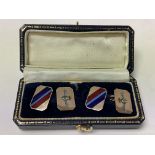 A pair of 9ct gold and enamel RAF cufflinks.