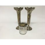 A pair of silver flower vases Hight 20cm and a sil