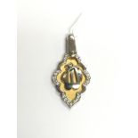 A 14ct yellow and white gold religious pendant, ap