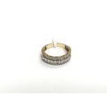 A gold half hoop ring set with clear stones, appro
