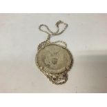 Silver dollar pendant on chain