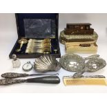 A collection of oddments including a silver dish,