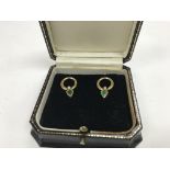 A pair of 18ct gold , emerald & diamond earrings