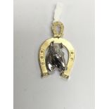 A quality yellow and white gold horseshoe pendant,