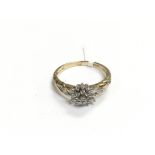 A 9ct gold three tier diamond set cluster ring wit