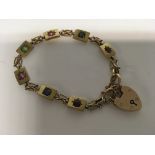 A Edwardian 15 ct gold bracelet with gem stones in