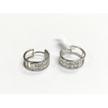 A pair of 9ct white gold stone set earrings, appro