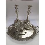 A collection of silver and silver plated items including inkwells, a locket, candlesticks etc.