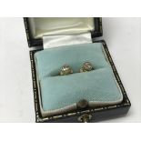 A pair of 18ct yellow gold diamond stud earrings,