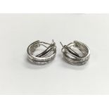 A pair of heavy 18ct white gold diamond set earrin