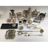 A collection of silver and silver plated items com