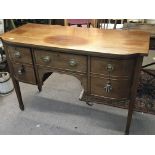 A late George III small sized sideboard with drawers and cupboards on square tapering legs. Length