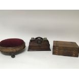 A Victorian round foot stool with ball and claw fe