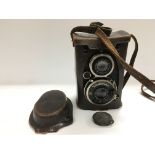 A Voigtlander Compur Superb camera in a fitted leather carry case.