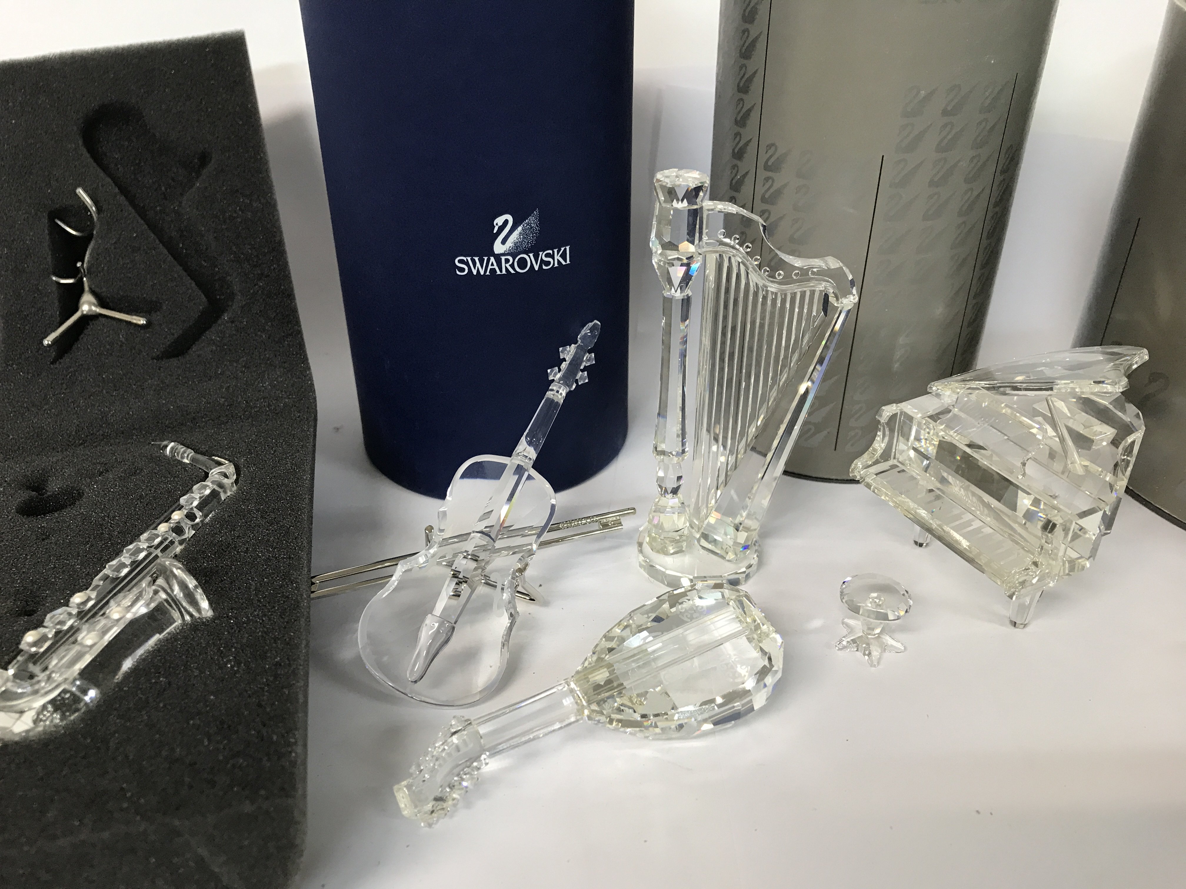 Five boxed Swarovski pieces including Violin, Saxophone, Grand Piano and Stool, Harp and Lute plus - Image 2 of 2