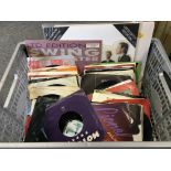 A box of 7inch singles by various artists plus som