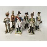 A collection of porcelain figures in the form of F