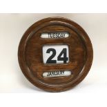 A vintage wooden framed circular wall calendar, ap