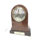 An early 20th Century inlaid mahogany mantel clock