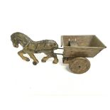 A tin plate clock work horse and cart toy with a m