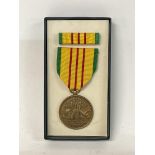 A boxed Vietnam service medal