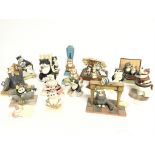 A collection of Comic & Curious cats figures.